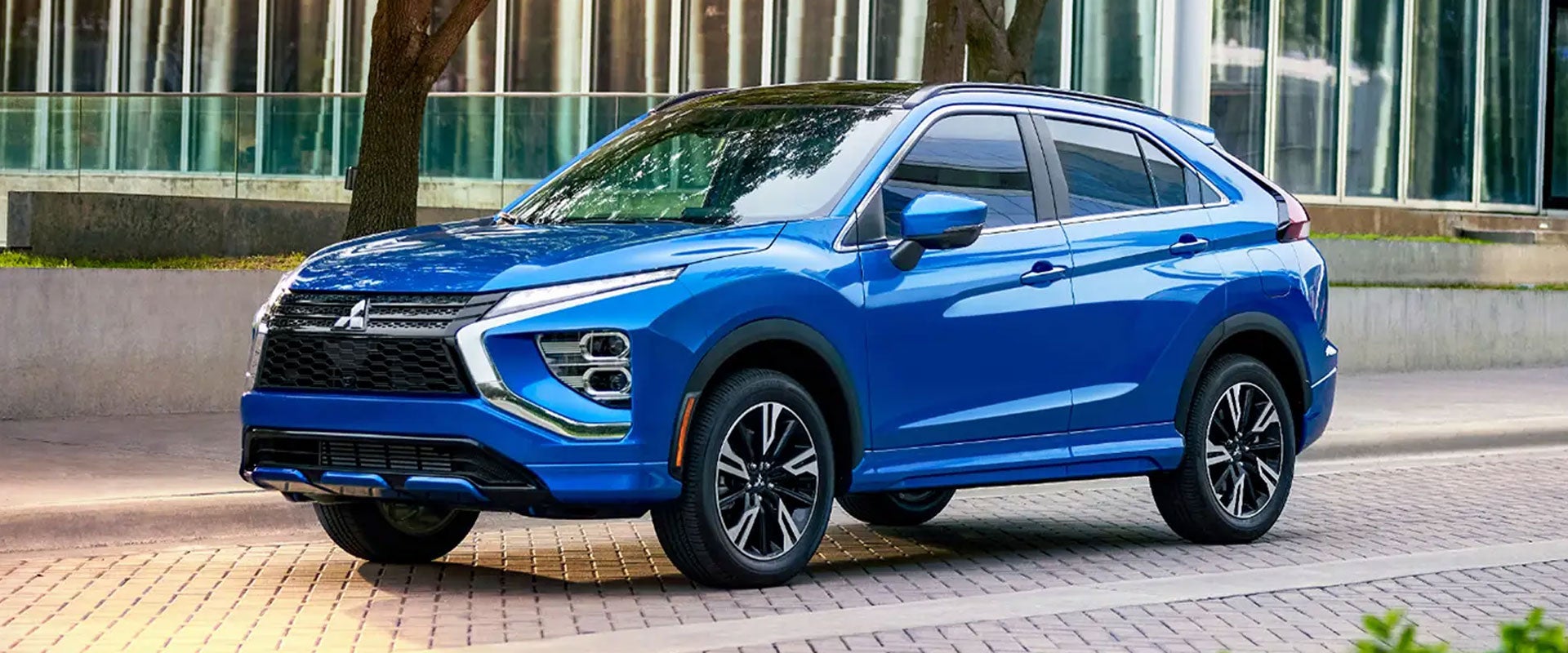 A white 2024 / 2025 Mitsubishi Eclipse Cross Compact SUV parked